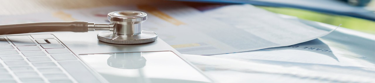 Medical stethoscope on laptop keyboard