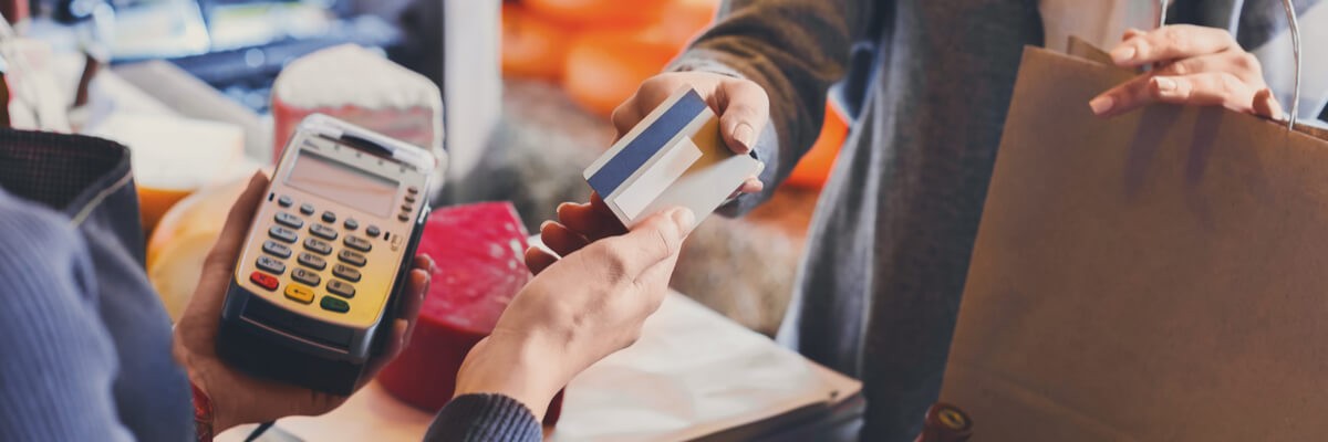 Merchant being handed a credit card