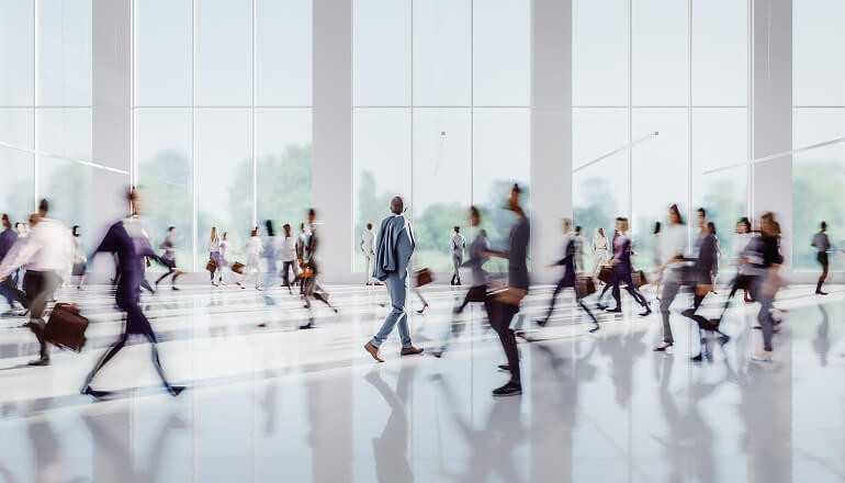 People walking in work building