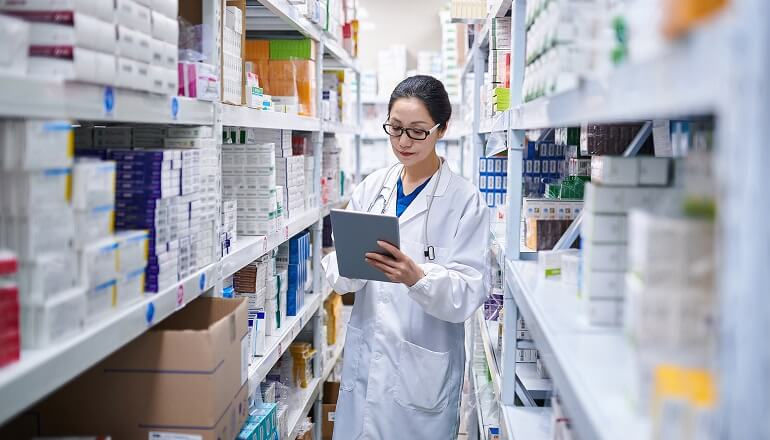 Simtra’s Cloud-First Strategy: Insight & Microsoft Fuel Global Mission Picture of someone working at a pharmacy