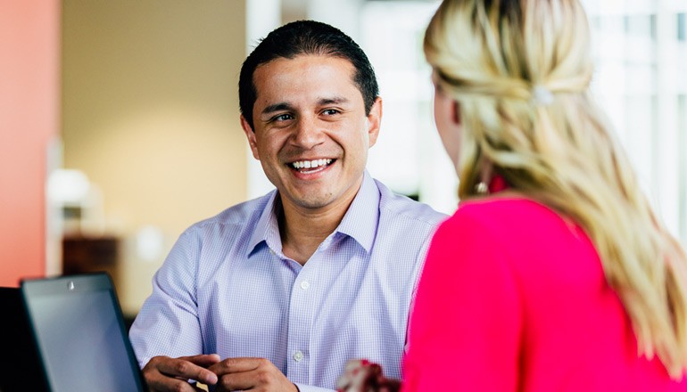 Is the Future of the Modern Workforce in the Cloud? Manager talking with employee in candid meeting