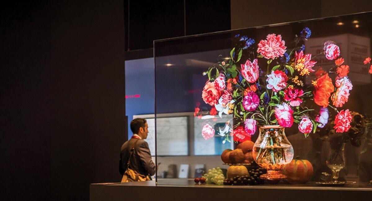 Trending Tech of 2019 Man looks at transparent OLED display