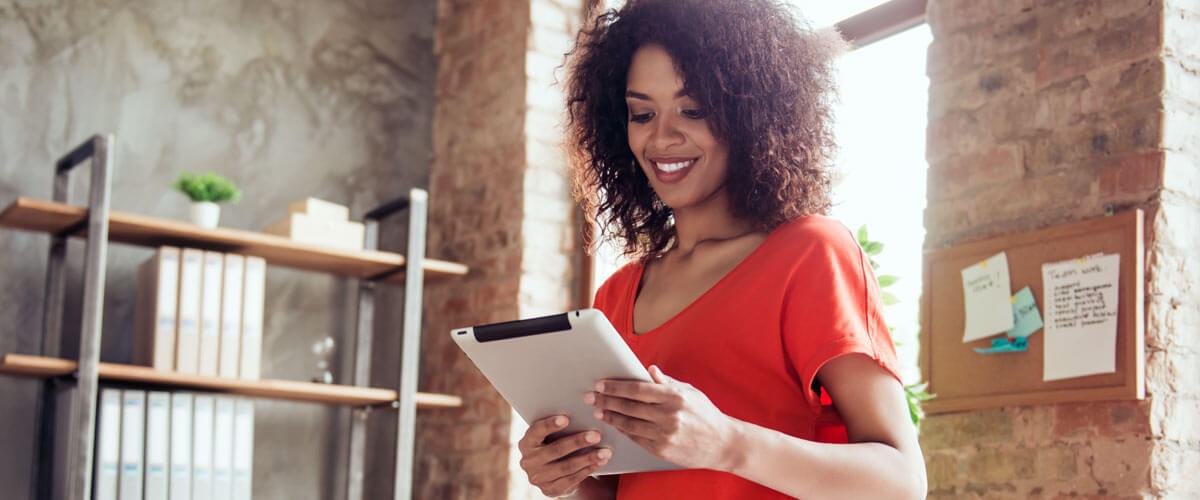 Business professional reading data off tablet computer. IT lifecycle management. IT lifecycle deployments. IT lifecycle 