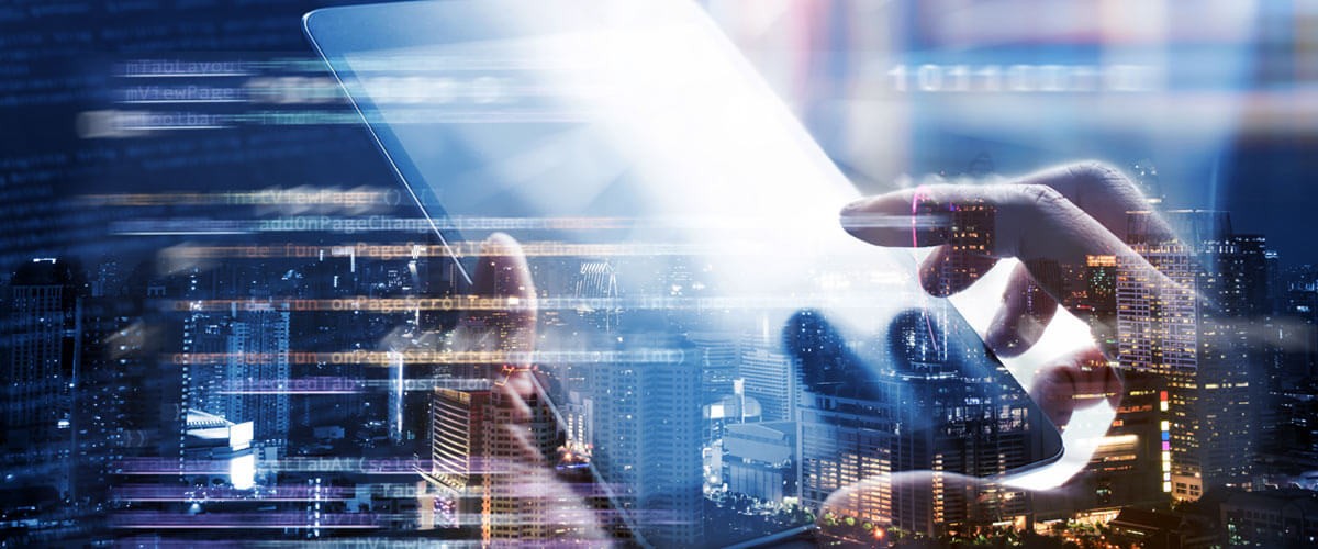 Hands typing on tablet computer. government software asset management, government cyberattacks, out-of-date software hacked