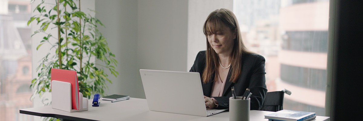 Woman working using Google laptop
