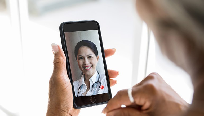 Learn how to navigate the landscape of telehealth solutions Patient with telehealth doctor. Global Telehealth Services, Remote Patient Monitoring, flatten the curve at the point-of-care
