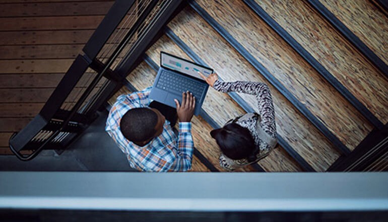 IT HP Security professionals huddle at stairwell. 