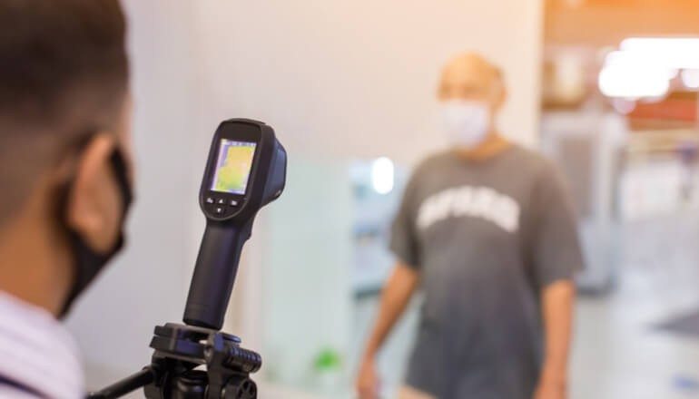 Remote learning Young child raising hand in remote learning education