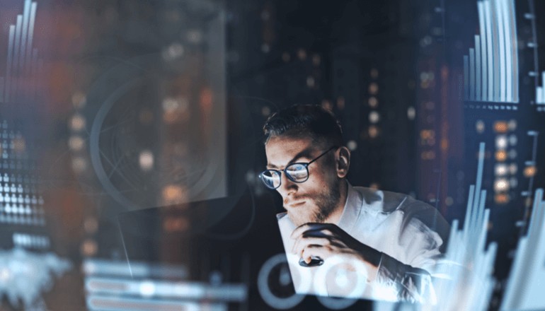 Man working at night on laptop