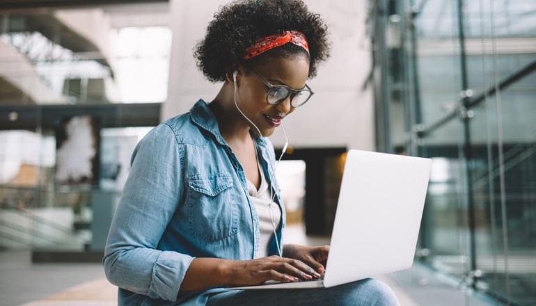 Man using laptop for work at home. Windows 11, Device deployment, device manageability, deployment and manageability 