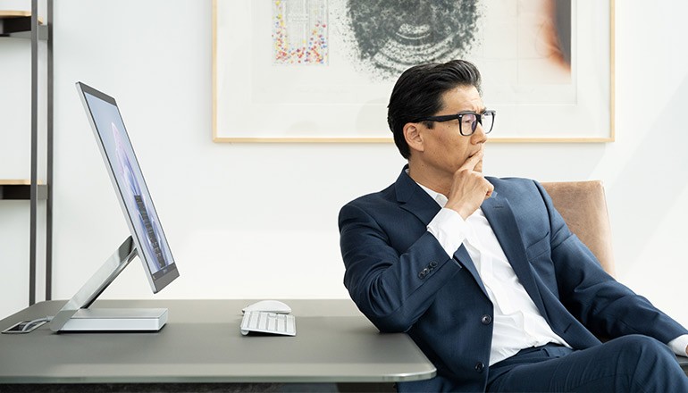 Businessman using desktop with Windows 11