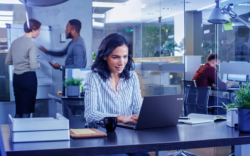 Woman usign her laptop at the office
