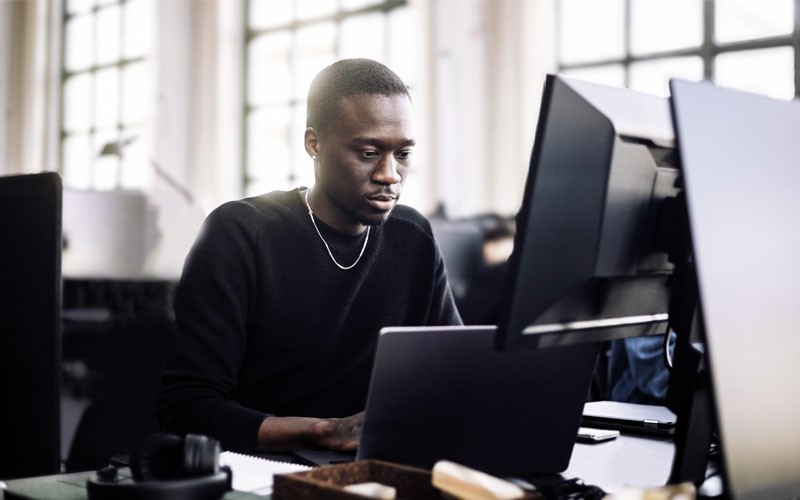 Businessman using email threat defense for his email on desktop computer