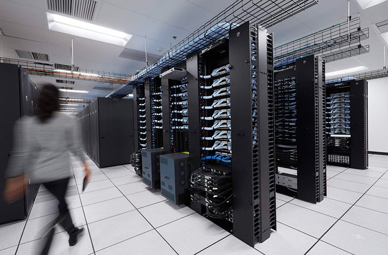 Take advantage of a breadth of options for storage servers Woman walking through Dell data center
