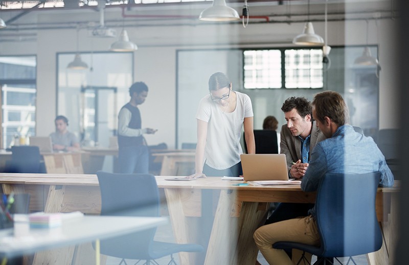 Group of business coworkers working together