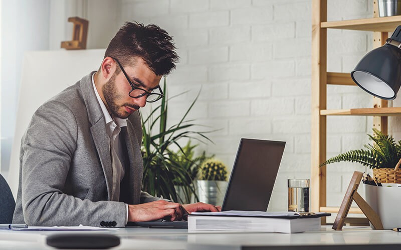 Get everything you need to create, collaborate and communicate in one place. Man working from home