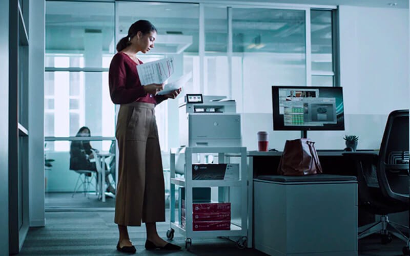 Woman standing in front of her station