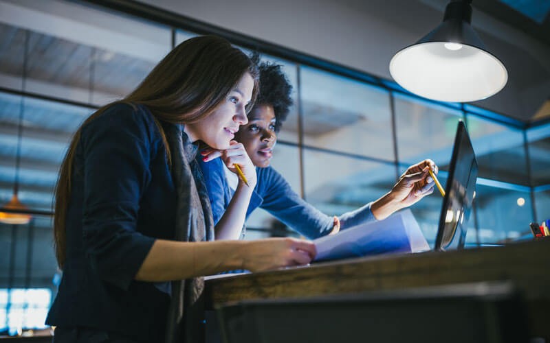female-colleagues-working-together-revsersed