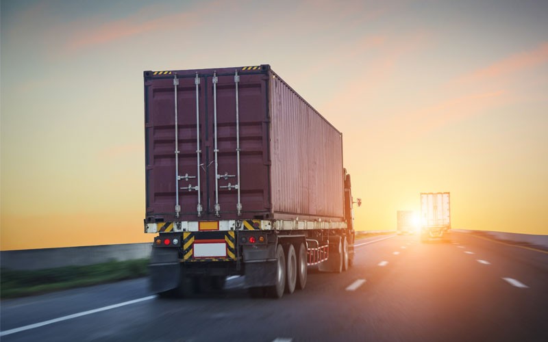 Back of truck driving down highway