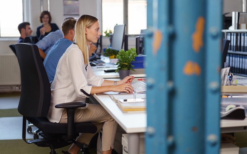 Businesswoman working in modern startup office