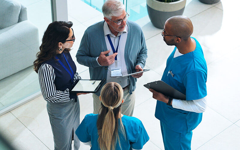 Healthcare workers talking with each other