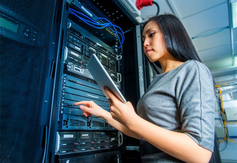 IT woman working in server room