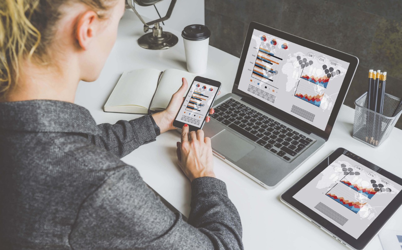 Woman using her devices at work