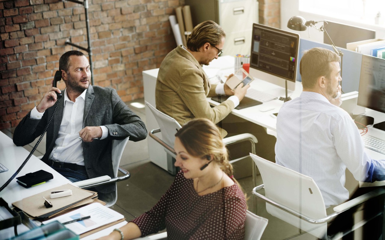 Teammates working together at the office