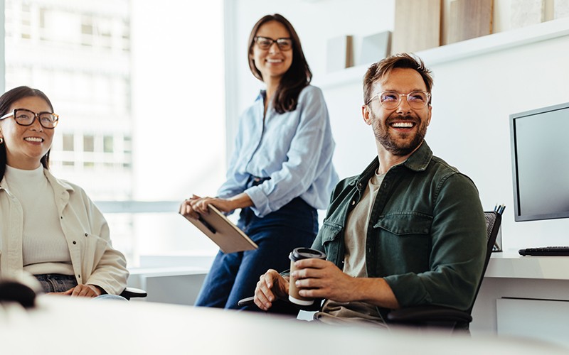 team-discussing-in-office-at-desks